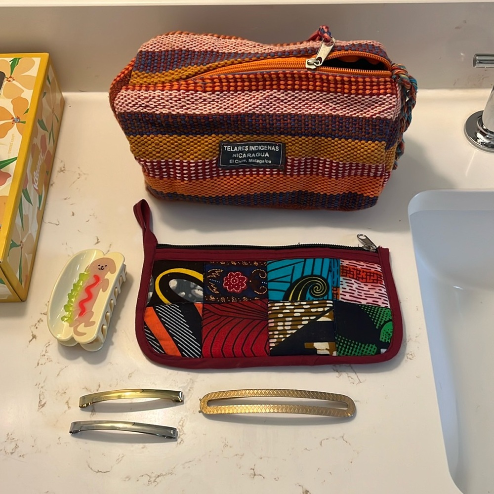 Lot of cute toiletry bags and hair clips
